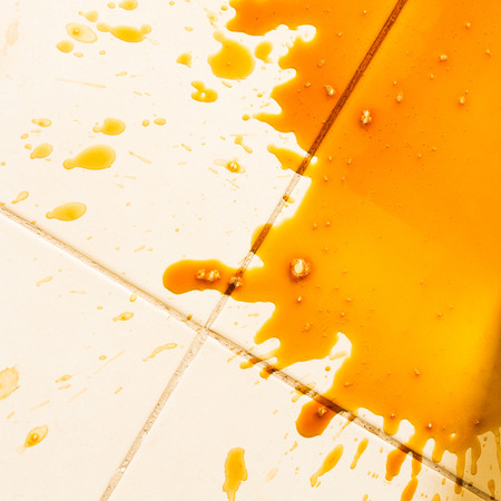 Spilled coffee on the floorの写真素材