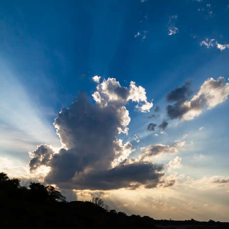 Beautiful blue sky with clouds and sun raysの写真素材