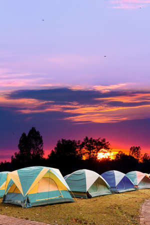 tourist tent with beautiful sunset backgroundの写真素材