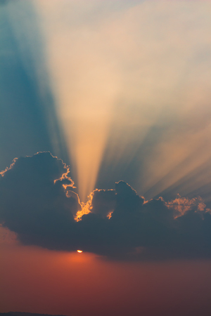 Beautiful sky with clouds and sun raysの写真素材