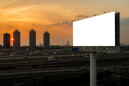 blank billboard beside express way at beautyful sunset used for advertisingの写真素材