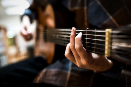 Hands of a guitar playerの写真素材