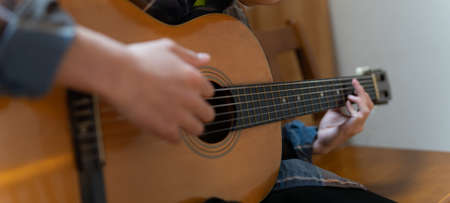 Hands of a guitar player