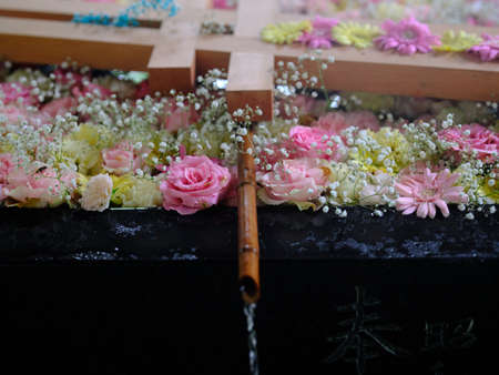 Flowers floating in the water of shrine