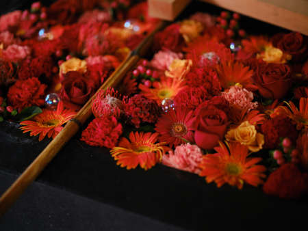 Flowers floating in the water of shrineの写真素材