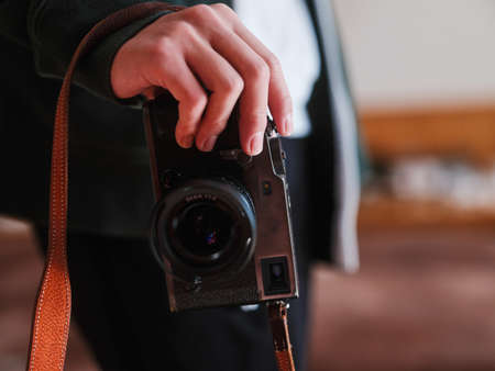 A person holding a classic cameraの写真素材
