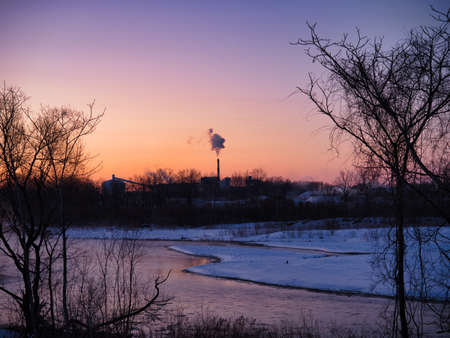 chimney smoke in winter early morning
