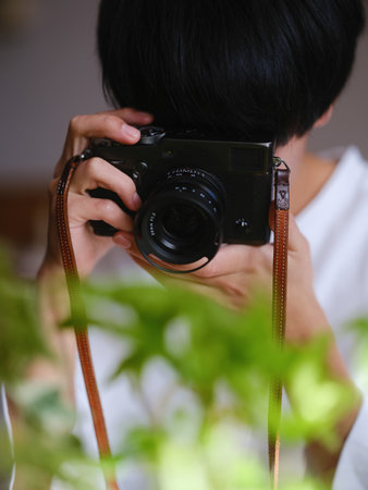 Photographer shooting with a classic cameraの写真素材