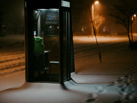 telephone booth in winter nightの写真素材