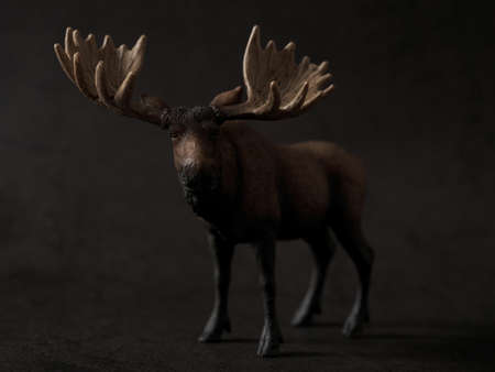 dark background paper and elk figureの写真素材
