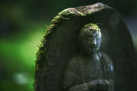 old stone statue in Japanの写真素材