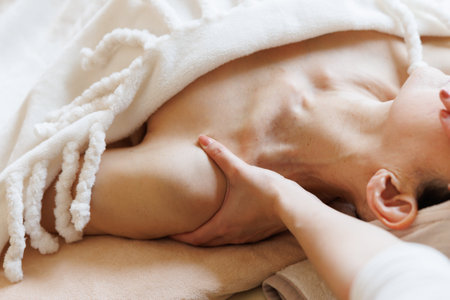 A woman receiving a body treatmentの写真素材