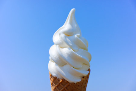 soft serve ice cream and blue skyの写真素材