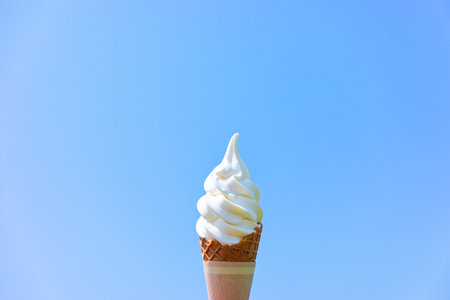 soft serve ice cream and blue skyの写真素材