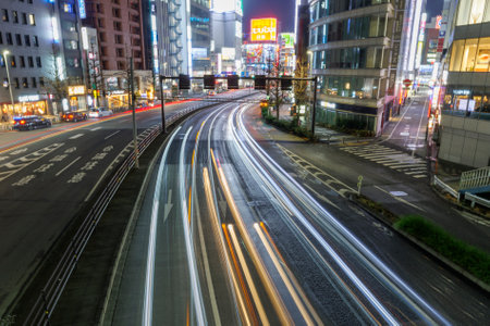 car trails in night tokyoの写真素材