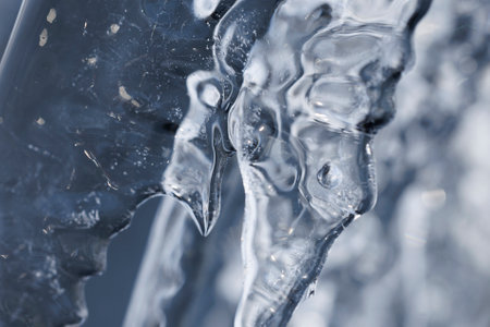 Close up of icicles on a frozen window. Shallow depth of field.の写真素材
