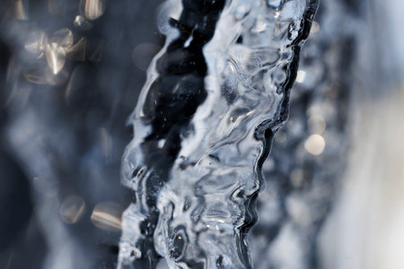 Close up of a frozen fountain with water droplets on it.の写真素材