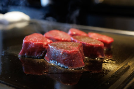 Grilling beef in an open kitchen