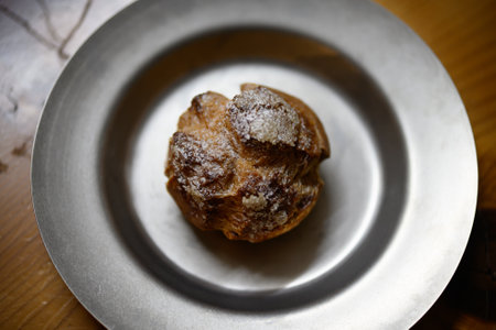 Cream puffs on a silver plate