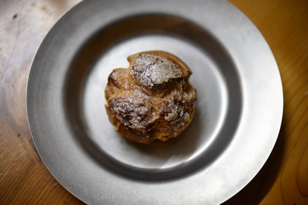 Cream puffs on a silver plate