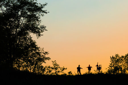 scarecrow and tree in sunset