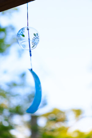Wind chimes in the garden. Selective focus with shallow depth of field.の写真素材