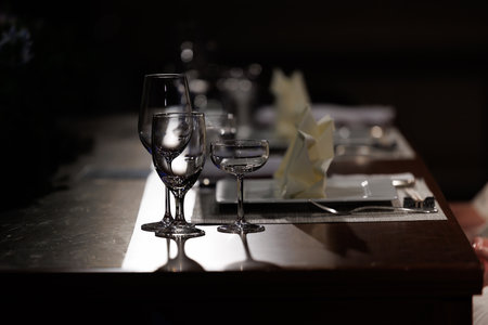 wedding table with glasses and cutlery in the restaurantの写真素材