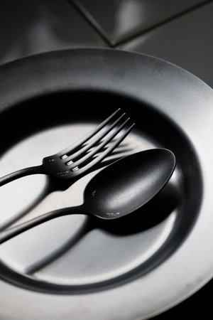 Antique spoons and forks lined upの写真素材