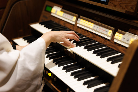 Pianist playing the organ in the church, close-up