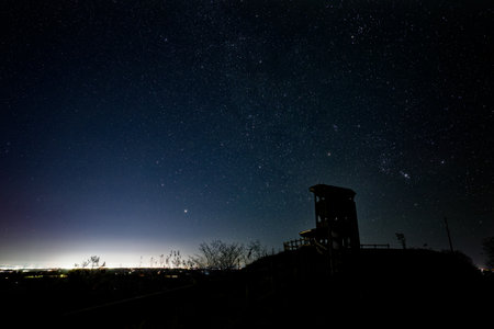 Milky Way and Silhouette of a Watchtower at night