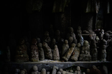 A row of stone Buddha statuesの写真素材