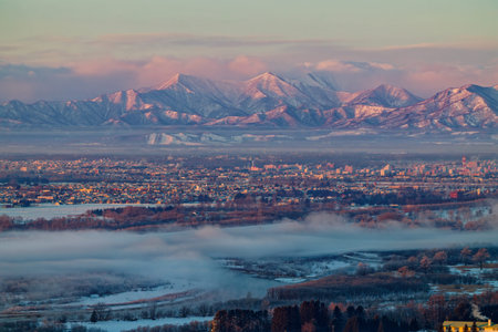 cold fog and mountainrange in hokkaidoの写真素材