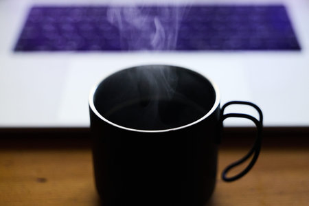 coffee and pc on deskの写真素材