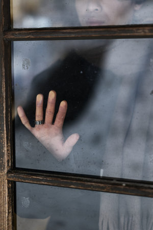Old window glass and hand