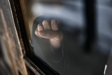 Old window glass and hand