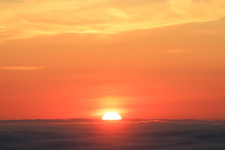 Sunset on the sea of clouds. Nature background. Sunset background.