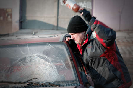 Hooligan smashing windshieldの写真素材