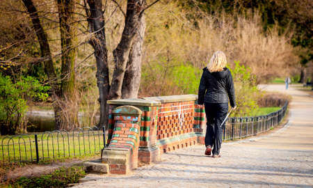 Attractive woman nordic walks in spring timeの写真素材