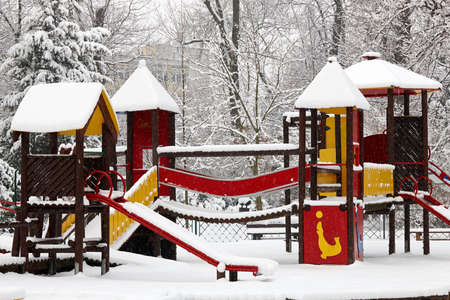 Children playground on snow blizzardの写真素材