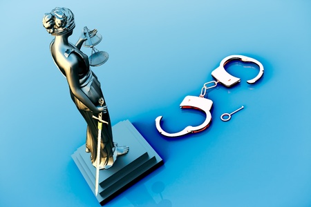 Themis statue and handcuffs over white backgroundの写真素材