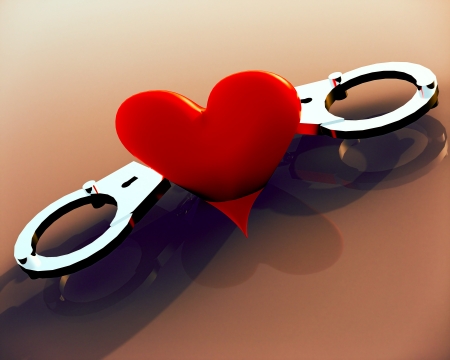 Love heart in handcuffs - conceptual illustration about bondsの写真素材