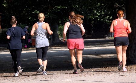 Four women running outdoorsの写真素材