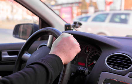 Drivers hand on wheel