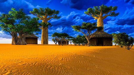 African village with traditional huts surrounded by baobab treesの写真素材