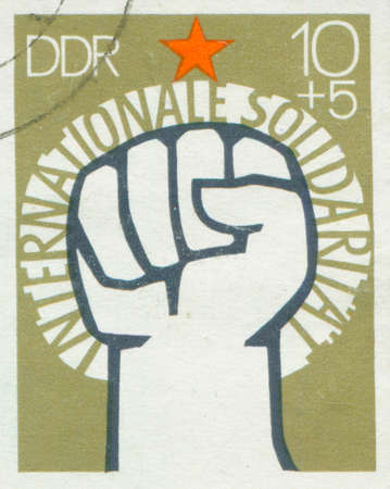 171e GERMANY - CIRCA 1972: A stamp printed in East Germany, showing of International Solidarity of Communists,のeditorial素材