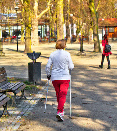 Attractive woman nordic walks in spring timeの写真素材