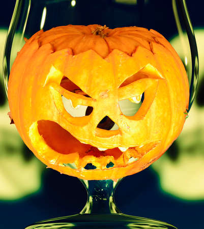 Halloween pumpkin in the glassの写真素材