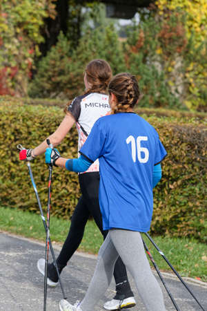 WROCLAW, POLAND - OCTOBER 15, 2017: People in fitness course nordic walking competition in the city parkのeditorial素材