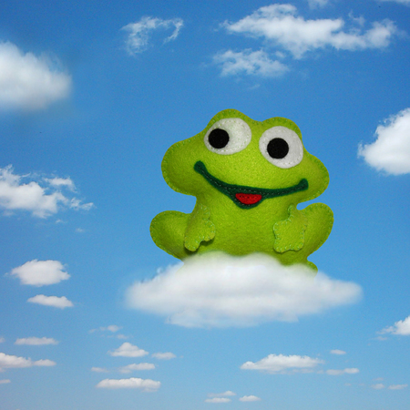 Frog perched on a cloud - kids toysの写真素材