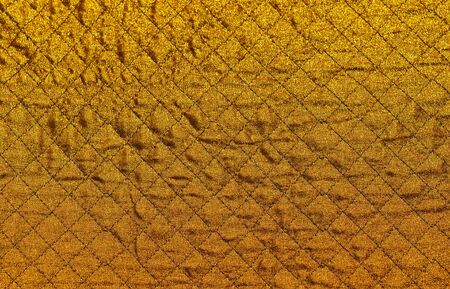 Gold rhomboid fabric backgroundの写真素材